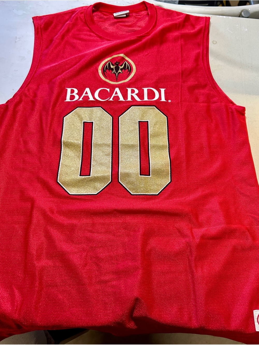 Red Sleeveless Game Jersey with Gold Accents Bacardi